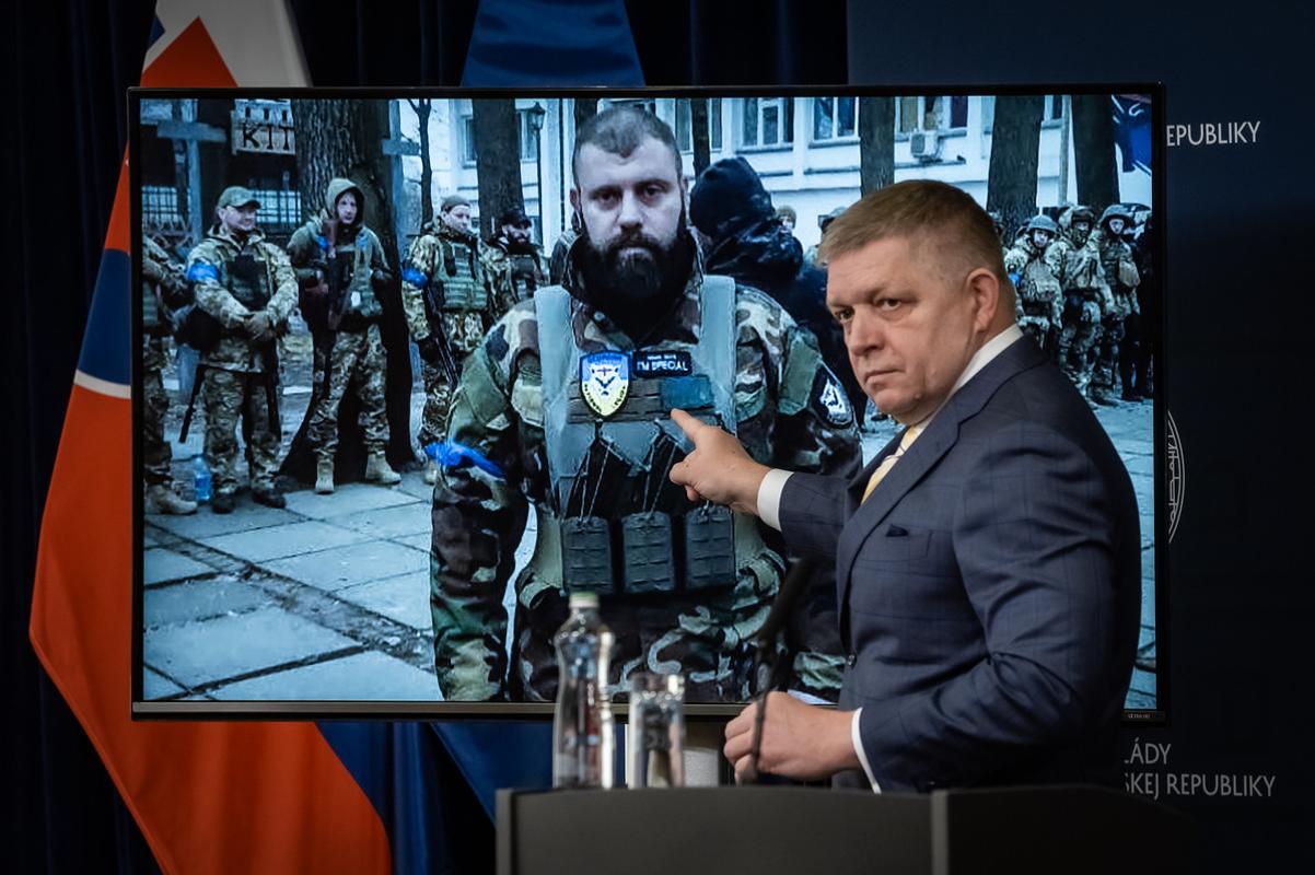 Slovak PM Robert Fico gestures in front of a photo of the commander of the Georgian National Legion, Mamuka Mamulashvili, during a press conference in Bratislava on Friday, January 31, 2025.