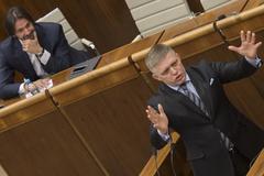 PM Robert Fico (front) eagerly defends Interior Minister Robert Kaliňák in parliament, before no-confidence vote. 
