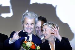 Far-right leader and candidate for next spring presidential elections Marine le Pen from France (r), and Dutch populist anti-Islam lawmaker Geert Wilders (l) stand together after their speeches during a meeting of European Nationalists in Koblenz, Germany, on January 21, 2017.