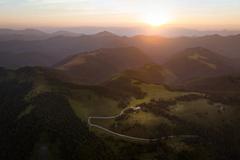 The Smrekovica mountain hut surrounded by hills.