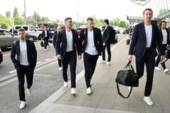 Slovak ice-hockey players arriving at the Bratislava airport to fly to Sweden. From left: Matúš Sukeľ, Dávid Mudrák and Andrej Golian.
