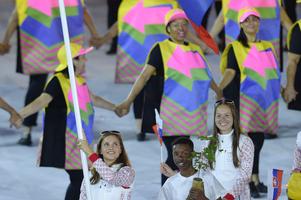 Shooter Dank barteková bears the Slovak flag at the opening cermeony of the Rio Olympics, August 5.