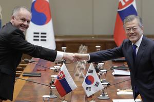 	
Slovakia's President Andrej Kiska, left, shakes hands with South Korean President Moon Jae-in before their meeting at the presidential Blue House in Seoul, South Korea, Tuesday, April 10, 2018. Kiska arrived on Monday for a three-day official visit to South Korea. 