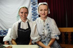 Left: a girl wearing a traditional working costume from Košariská. Right: a girl wearing a Myjava costume used for celebrations.