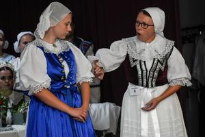 Folk costumes in Brezová pod Bradlom. The costume on the left was worn by girls, the other on the right was worn by women.