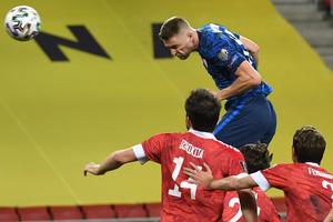 Milan Škriniar (in blue) before scoring the opening goal at the FIFA World Cup 2022 qualifier match in Trnava.