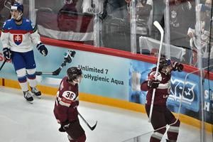 Latvia's Haralds Egle (right) celebrating a goal.