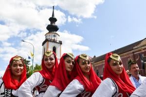 Members of a folklore ensemble from Albania during the procession in Myjava.