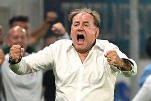 Slovan Bratislava coach Vladimír Weiss is celebrating after his team scored the fourth goal.