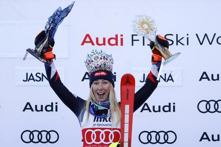 Mikaela Shiffrin celebrates on the podium after winning the women's World Cup slalom race in Jasná.