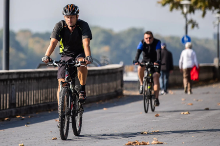 Cyclists on the Danube riverbank.