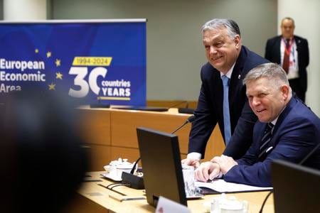 Slovakia's Prime Minister Robert Fico, right, and Hungary's Prime Minister Viktor Orbán pose for photographers during a round table meeting at an EU Summit in Brussels on March 22, 2024.