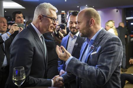 Presidential candidate Ivan Korčok (l) and Demokrati leader Jaroslav Naď hold a conversation on March 23, 2024.
