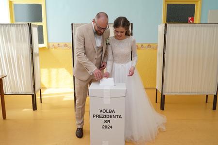 Newlyweds vote in the second round of the presidential election on April 6, 2024.