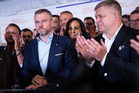 Speaker of Parliament Peter Pellegrini (Hlas) became the Slovak president-elect on April 6, 2024 after defeating his rival Ivan Korčok in a runoff. In the picture, populist PM Robert Fico applauds Pellegrini's victory.