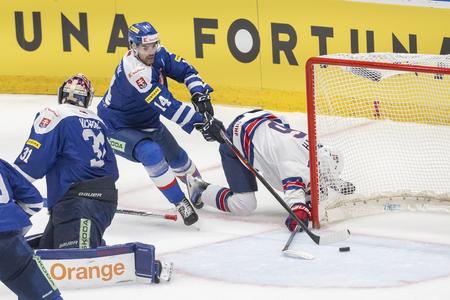 Goalkeeper Samuel Hlavaj, Peter Čerečňák (both Slovakia) and goal scorer William Smith (USA) during a friendly match between Slovakia and the USA ahead of the upcoming Ice Hockey World Championships in Bratislava on Tuesday, May 7, 2024.