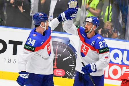 The joy of Slovak forwards, goal scorer Peter Cehlárik, left, and Marek Hrivík, right, during the Slovakia - Poland game at the Ice Hockey World Championship in Ostrava on May 15, 2024.
