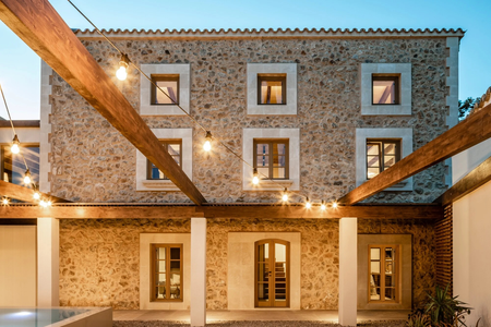 Slovak architects turned a 300-year-old stone house into a modern guest house.