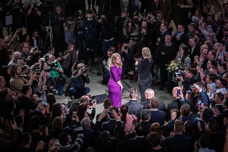 Journalists and supporters surround Zuzana Čaputová after she wins the presidential election in Bratislava on March 30, 2019.