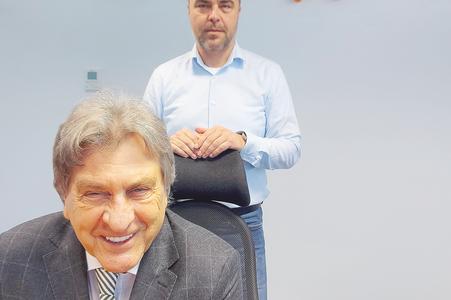 Jozef Petrík with his son Pavol Petrík in the back.