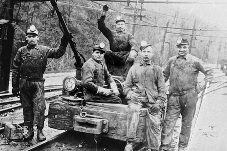 My grandfather John Mager, seated top center boldly holding the line with his western Pennsylvania coal mining crew in the early 1920s. He found a Slovak sweetheart also from Šariš in the U.S. and they had a large family, including my mother Elizabeth.