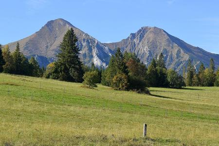 The highest peaks of the Belianske Tatry mountain range, Ždiarska vidla (2,142 metres above sea level - on the left) and Havran (2,152 metres above sea level), as seen from the village of Ždiar.