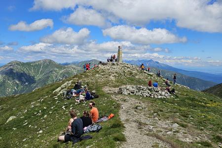 Resting on Baranec's summit after demanding hike 