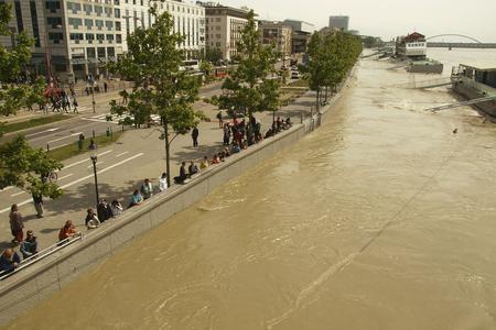People watch the water level of the Danube at Rázus Embankment on June 6, 2013 in Bratislava.