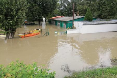 A sad view on the boathouse of the Dunajčík canoe club from the flood barrier.  