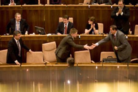Prime Minister Robert Fico (left) shakes hands with Foreign Affairs Minister Ján Kubiš after the Slovak Parliament adopted the Lisbon Treaty on April 10.
