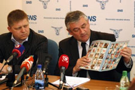SNS leader Ján Slota gives journalists a history lesson, as Prime Minister Robert Fico looks on.
