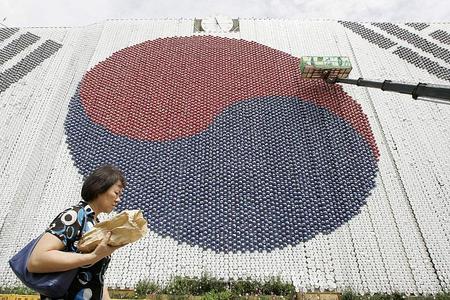 Seoul City Hall, pictured covered by a South Korean national flag made of about 27,000 plastic balls, in August 2008. The flag was made to commemorate Liberation Day on August 15. 