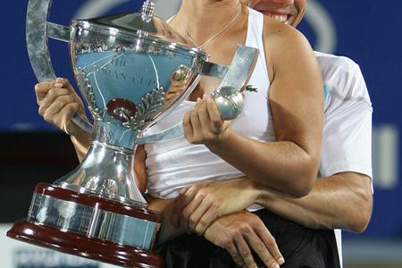 Dominika Cibulková and Dominik Hrbatý celebrate their unexpected victory in the final of tennis's Hopman Cup.