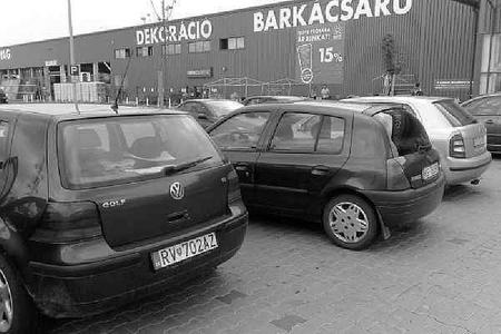 Slovak-registered cars parked at a store in Hungary