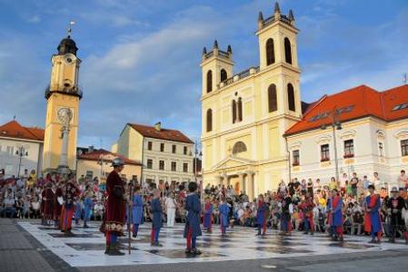 Chess figurines parade through the main square in Banská Bystrica.  