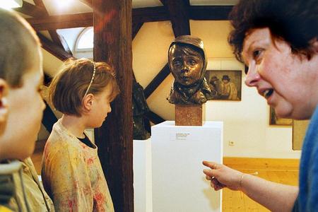 A bronze of the Czech actor Josef Abrhám by Jan Habarta, entitled Whistling Boy, is the most famous exhibit of the Slovácko Museum in Uherské Hradiště.