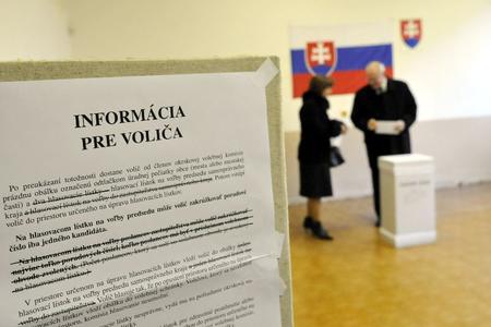President Ivan Gašparovič and his wife Silvia vote.