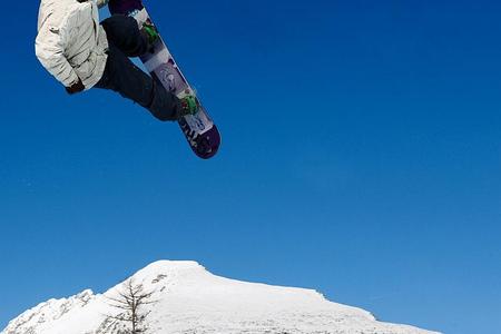 A snowboarder catching air at Štrbské Pleso.