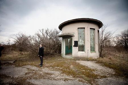 Tomáš Mikulec from the Nie ropovodu cez Žitný Ostrov civic association in front of an abandoned water facility in Podunajské Biskupice. 