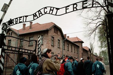 Young people remember Holocaust victims.