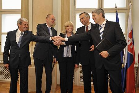 Coalition partners share a united gesture as their election term begins.