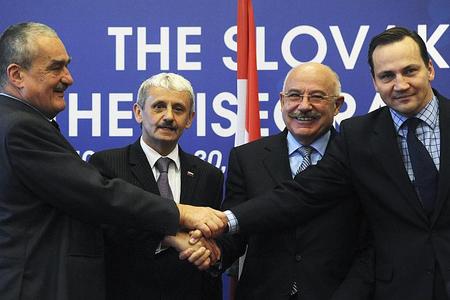 The foreign ministers of the Visegrad Group countries (from left) – Karel Schwarzenberg (Czech Republic), Mikuláš Dzurinda (Slovakia), János Martonyi (Hungary) and Radoslaw Sikorski (Poland) – shake hands after their meeting in Bratislava on October 22.