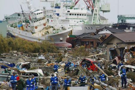 Soldiers and firefighters search for the victims in the rubbles on March 14 in Matsushima, Miyagi Prefecture, Japan, three days after northeastern coastal towns were devastated by an earthquake and tsunami. 