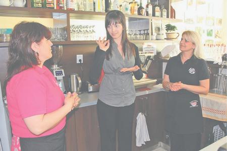 The café’s owner (centre) and her staff.