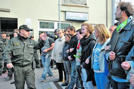 Several activists formed a humanchain to block anti–Roma marchers in Bratislava.