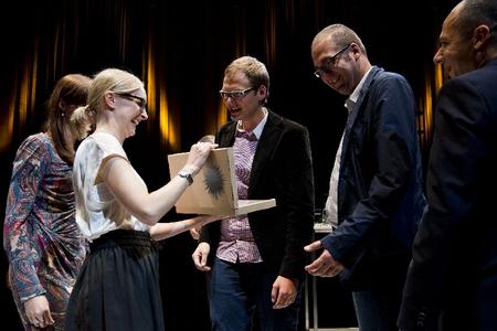 Two Bratislava-based streetwork organisations - Vagus and Odyseus, and civic association Návrat (from Banská Bystrica) received Honorary awards of the ERSTE foundaiton for social integration, for the year 2013. Statutory representative of Vagus Sergej Kára (C) and its chairman Peter Adam (R) receive the award. 