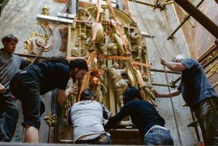 Experts moving a stone altar in Nitra that covered a unique 14th century fresco.