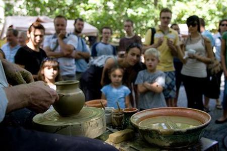 A pottery display with a craftsman of ÚĽUV, the Centre For Folk Art Production