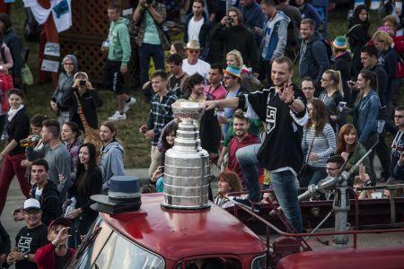 Hockey player Marián Gáborík riding around the festival with the Stanley Cup. 