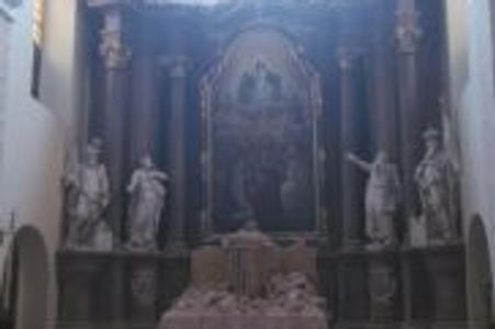 The collapsed tower partially demolished the church.